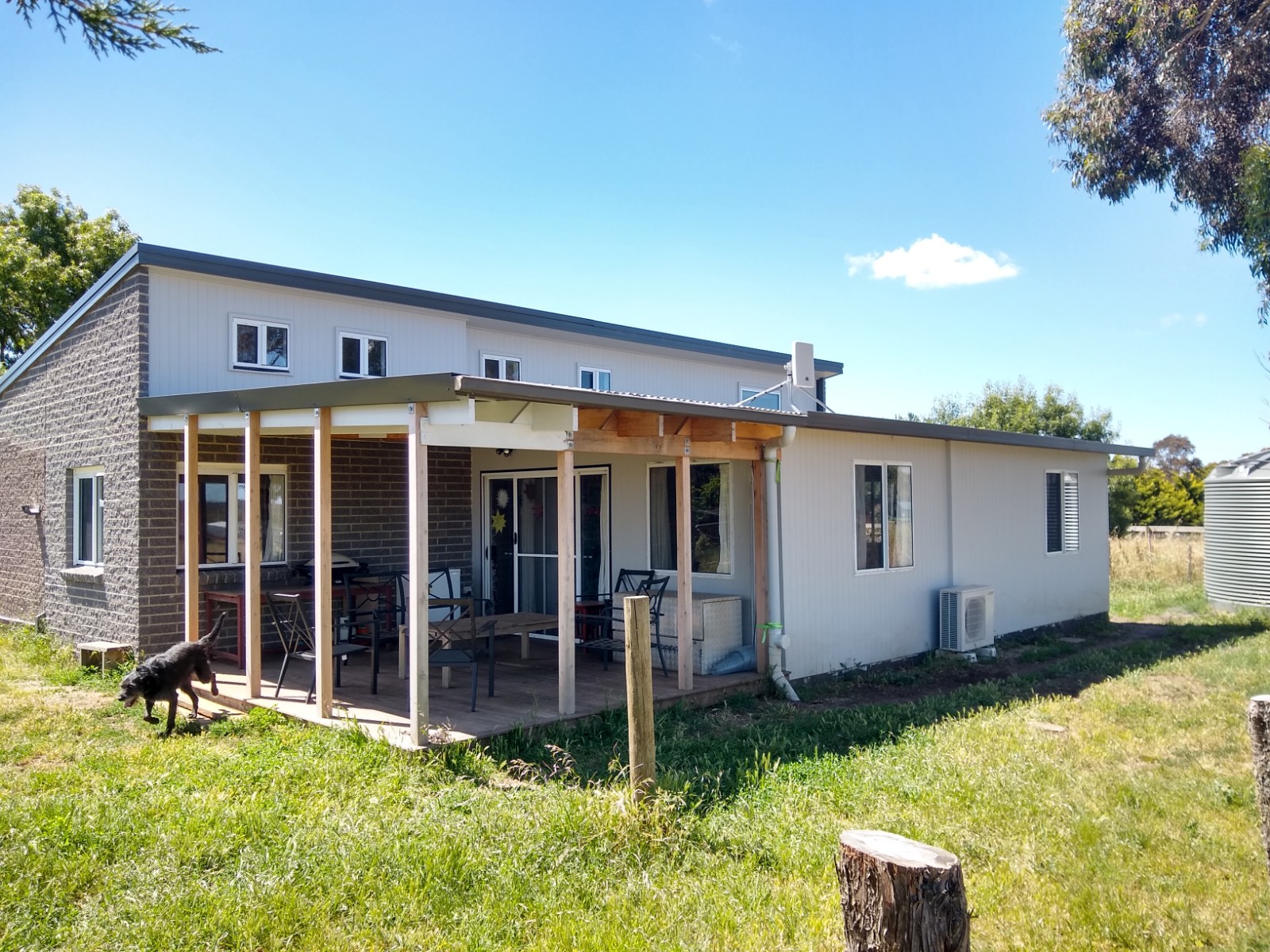 Grey SIPs home exterior on rural property